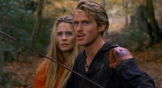 Westley protects Buttercup, his sword drawn.