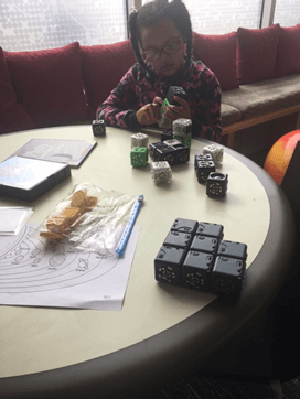 Girl playing with Cubelets
