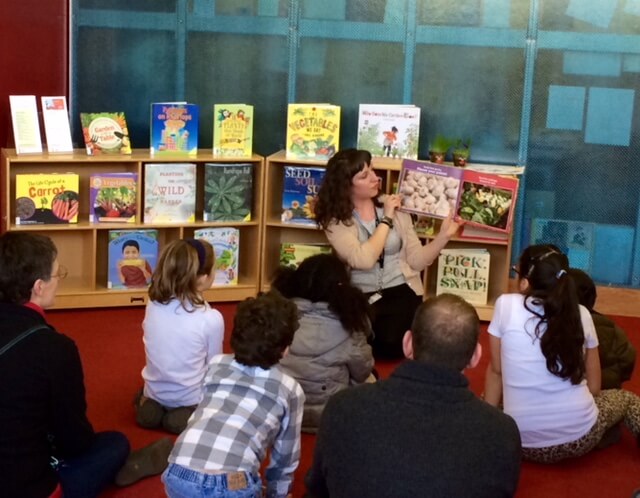 Reading a book during a school age program.