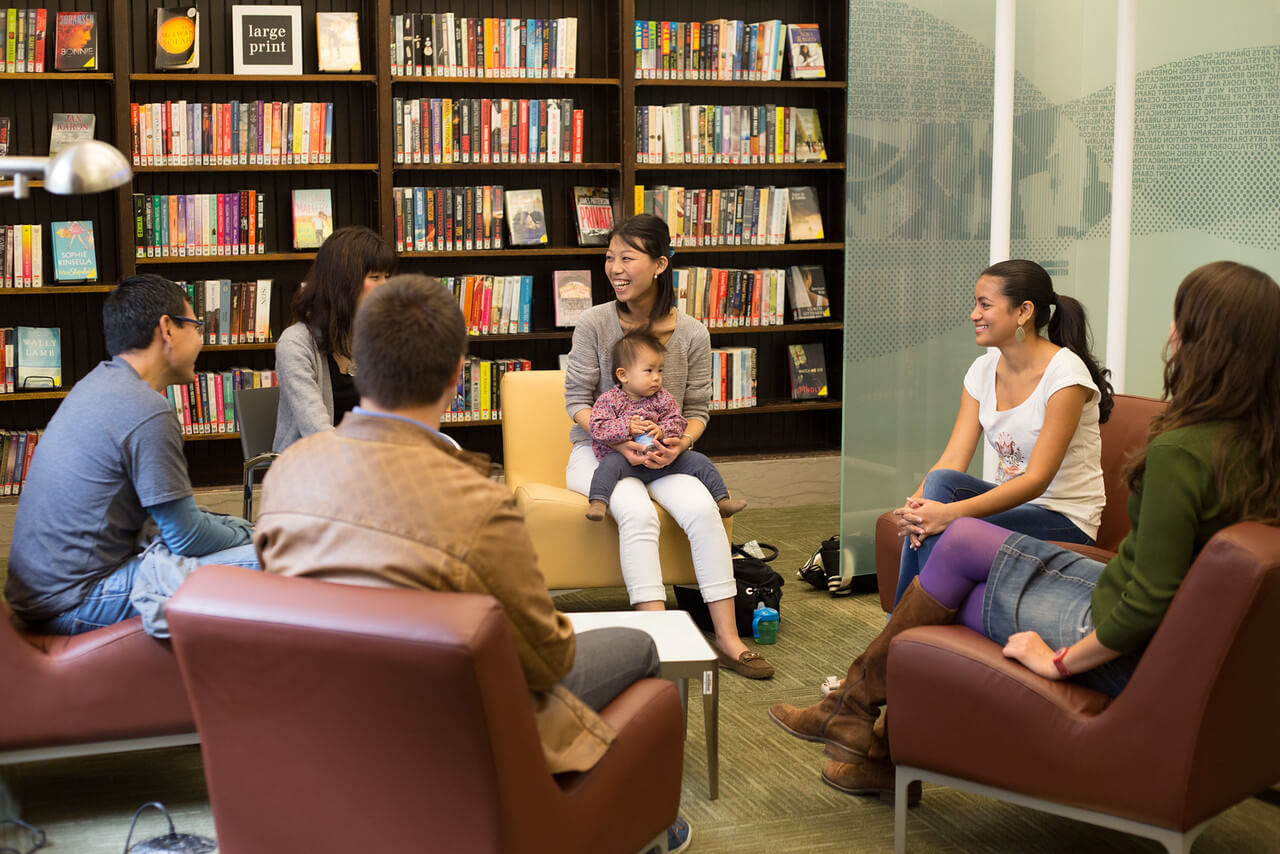 library patrons sitting in a language learning circle