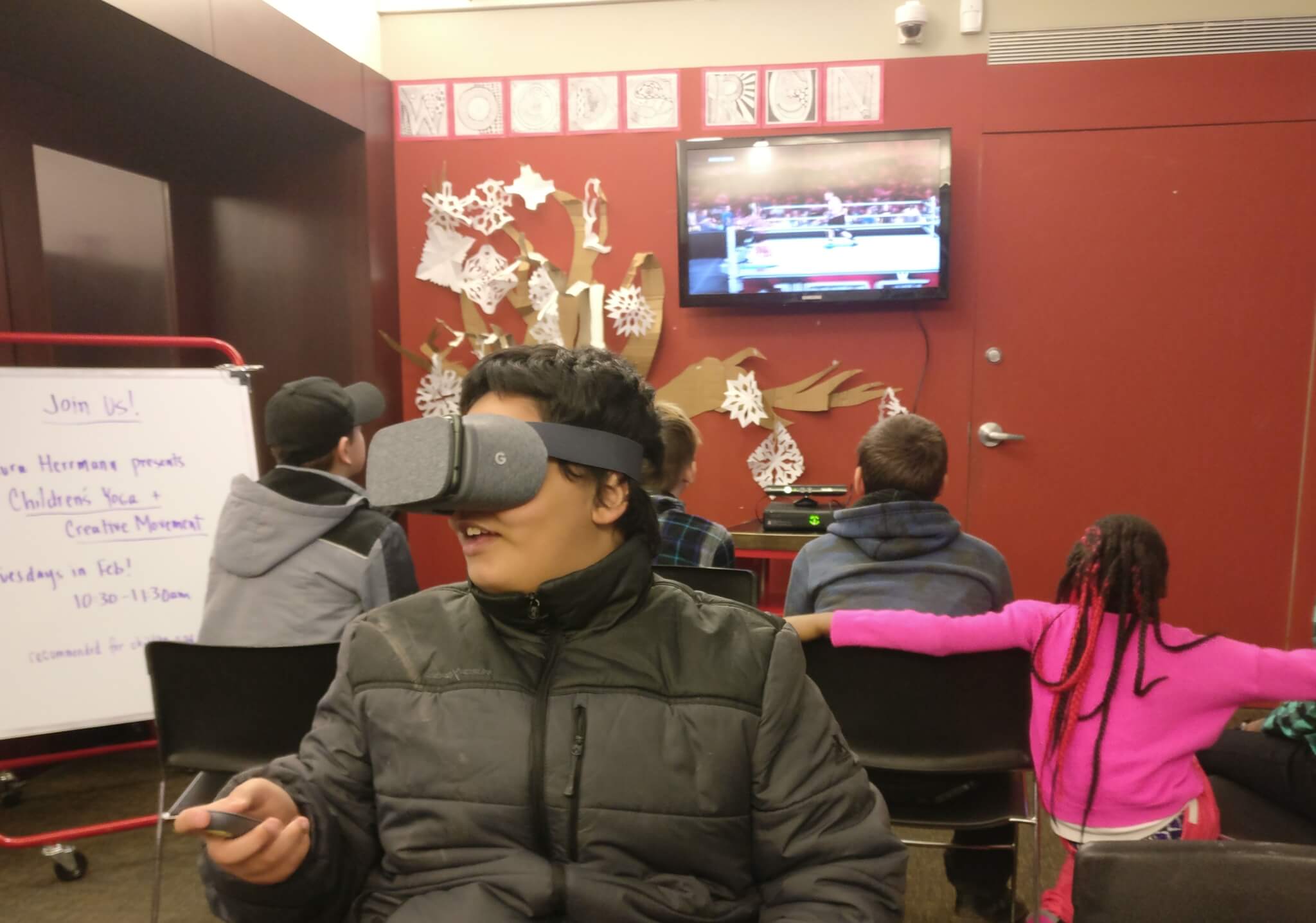 Teens using Virtual Reality headsets and playing video games during Teen Time