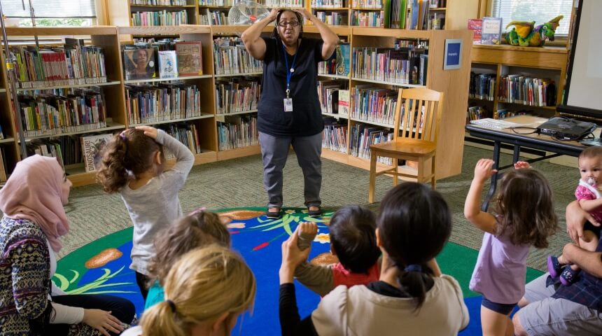 Librarian leads children in storytime