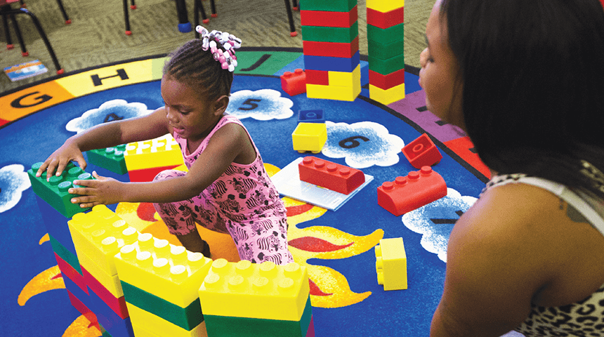 parent and child play with blocks