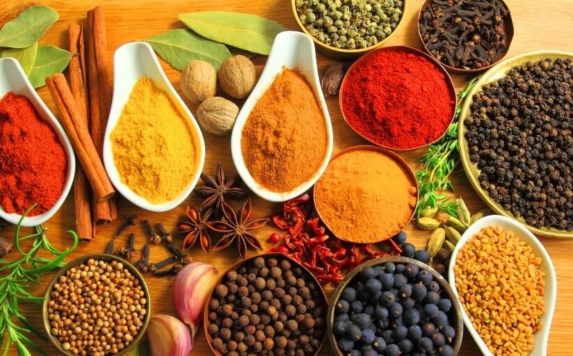 A colorful palette of Indian spices and herbs