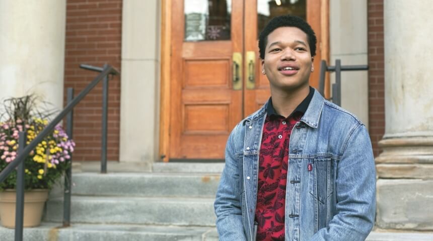 2018 Teen Advocate of the Year Jeremiah Fielder stands on the front steps of the CLP - West End library
