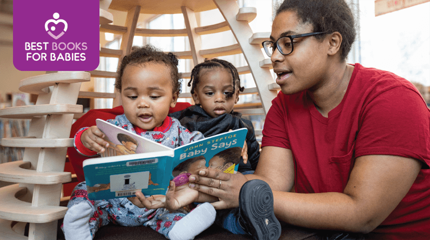 Parent reads a 'Best Books for Babies' book with two young children at the library