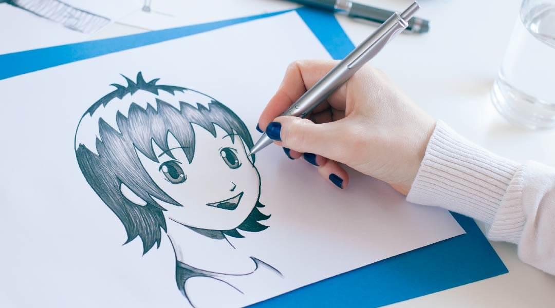 Detail of a hand drawing an anime style cartoon.