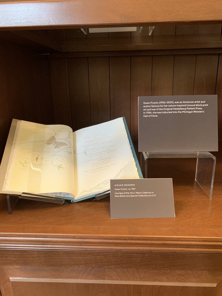 Book opened up on a stand for an exhibit