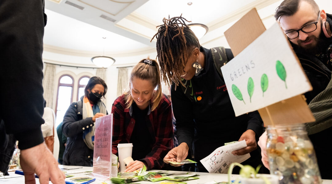 Seed swap participants gathered at an event table