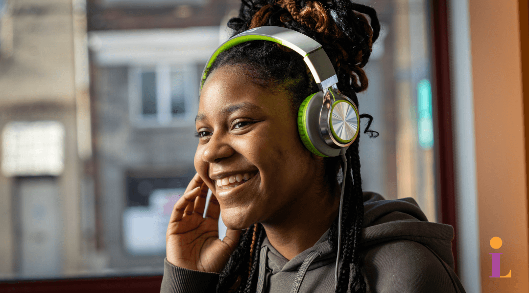 Smiling teen girl listening to headphones